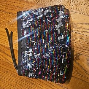 Victoria's secret makupbag or clutch. Colorful shiny front. Zipper closure